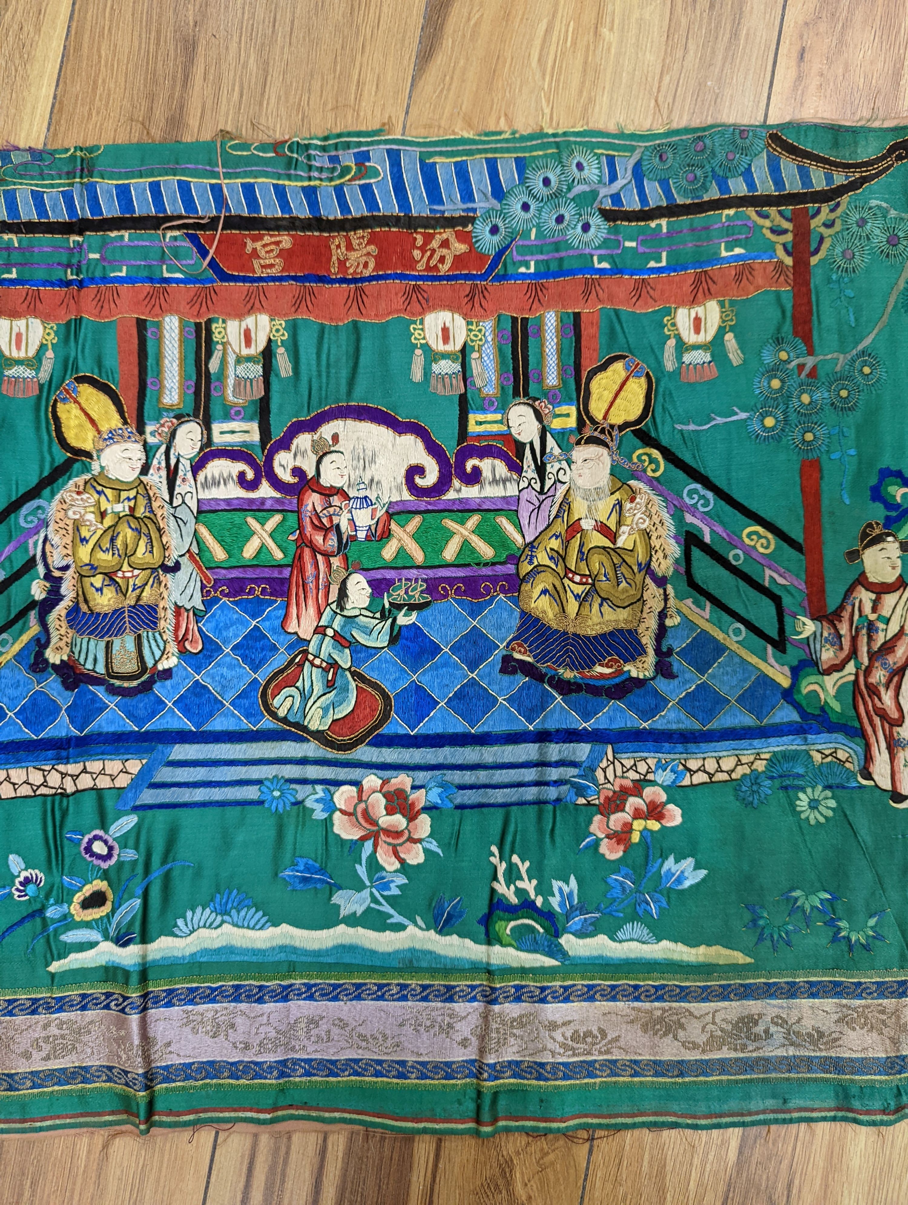An early 20th century Chinese silk figurative embroidery from a larger panel of an emperor and empress scene.